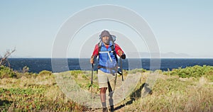 Mixed race man with prosthetic leg hiking in nature