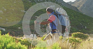 Mixed race man with prosthetic leg hiking in nature