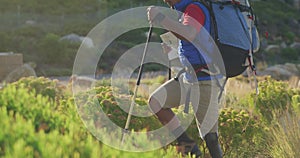 Mixed race man with prosthetic leg hiking in nature