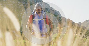 Mixed race man with prosthetic leg hiking in nature