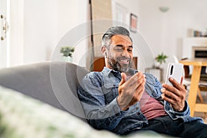 Mixed race man in video call with smartphone