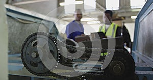 Mixed race man working in factory