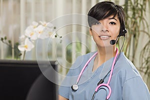 Mixed Race Nurse Practitioner or Doctor at Computer