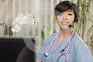 Mixed Race Nurse Practitioner or Doctor at Computer photo