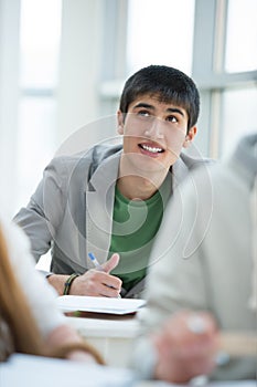 Mixed race student dreaming and looking upwards