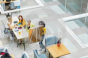 Mixed race team working with whiteboard in office