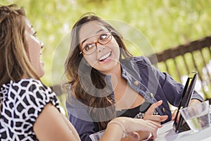 Mixed Race Teen Girls Working Together on Tablet Computer