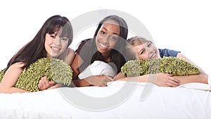 Mixed race teenage girl friends at slumber party photo
