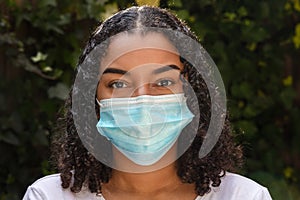 Mixed Race Teenager Girl Woman Wearing Coronavirus COVID-19 Face Mask