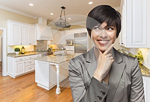 Mixed Race Woman Looking Back Over Shoulder Inside Custom Kitchen