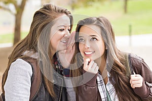 Mixed Race Woman Whispering Secrets Outside