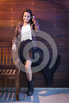 Mixed Race Young Adult Woman Portrait Against Wooden Wall