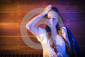 Mixed Race Young Adult Woman Portrait Against Wooden Wall