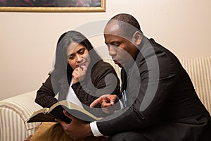 Mixed Raced Christian Couple Studying Bible Together