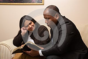 Mixed Raced Christian Couple Studying Bible Together