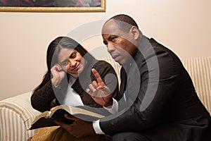 Mixed Raced Christian Couple Studying Bible Together