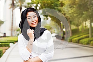 Mixed raced muslim woman on a street of Dubai city
