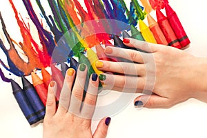 Mixed rainbow children`s manicure and drawing .