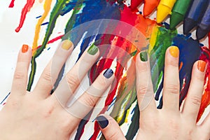 Mixed rainbow children`s manicure and drawing .