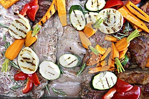 Mixed raw meat and grilled vegetables marinating ready for barbeque.