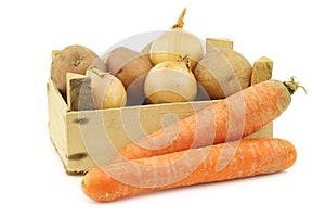 Mixed root vegetables for making `hutspot` in a wooden crate