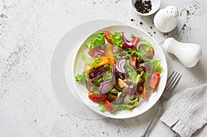 Mixed salad leaves, cherry tomatoes and red onions fresh salad