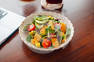 Mixed Salad with Fruit and Avocado on the table