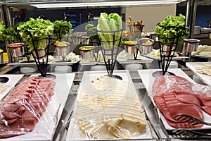 Mixed sausage appetizers on the buffet.