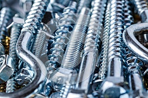 Mixed screws and nails. Industrial background. Home improvement.bolts and nuts.Close-up of various screws. Use for background, top