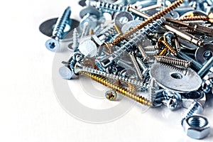 Mixed screws and nails. Industrial background. Home improvement.bolts and nuts.Close-up of various screws. Use for background, top