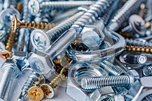 Mixed screws and nails. Industrial background. Home improvement.bolts and nuts.Close-up of various screws. Use for background, top