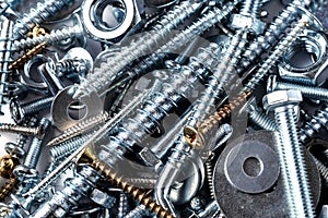 Mixed screws and nails. Industrial background. Home improvement.bolts and nuts.Close-up of various screws. Use for background, top