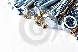 Mixed screws and nails. Industrial background. Home improvement.bolts and nuts.Close-up of various screws. Use for background, top