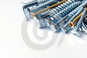 Mixed screws and nails. Industrial background. Home improvement.bolts and nuts.Close-up of various screws. Use for background, top