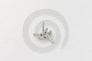Mixed screws on white background with copy space