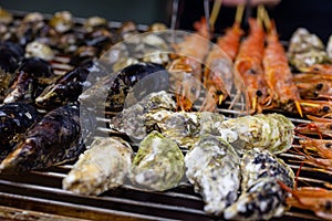 Mixed seafood barbecue on grill