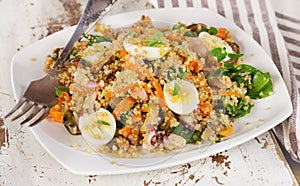 Mixed seafood salad with quinoa and quail eggs.
