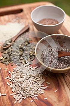 Mixed seeds on wooden background