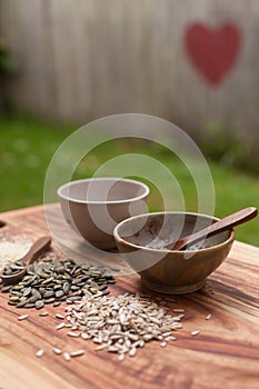 Mixed seeds on wooden background