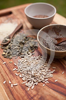 Mixed seeds on wooden background