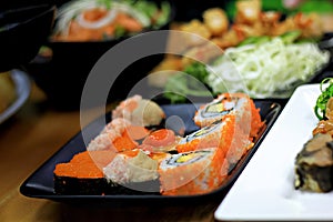 Mixed sushi on a plate in a Japanese restaurant