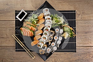 Mixed sushi roll and salmon sashimi