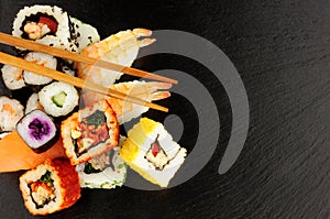 Mixed Sushi Rolls On A Slate Background