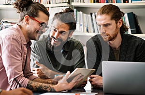 Mixed team of software engineers brainstorming ideas. Diverse app developers collaborating as group