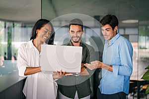 Mixed team of software engineers brainstorming ideas. Diverse app developers collaborating as group