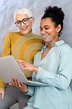 Mixed team of software engineers brainstorming ideas. Diverse app developers collaborating as group