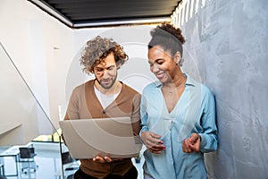 Mixed team of software engineers brainstorming ideas. Diverse app developers collaborating as group