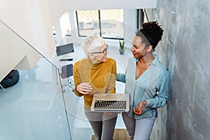 Mixed team of software engineers brainstorming ideas. Diverse app developers collaborating as group