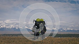 The mixed terrain cycle touring bike with bikepacking. The trip on multitrack bike, outdoor road in mountain snow capped