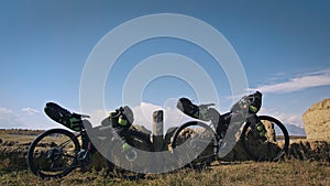 The mixed terrain cycle touring bike with bikepacking. The trip on multitrack bike, outdoor road in mountain snow capped